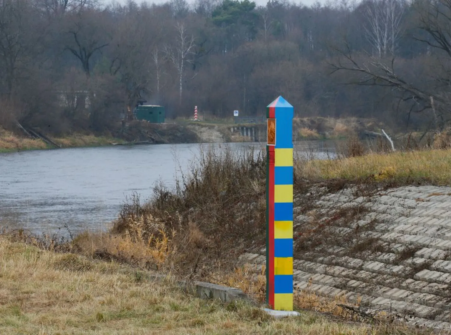 Belarusian-Ukrainian and Polish border sign posts are seen at the border with Belarus and Poland in Volyn region, Ukraine November 16, 2021. REUTERS/Gleb Garanich

