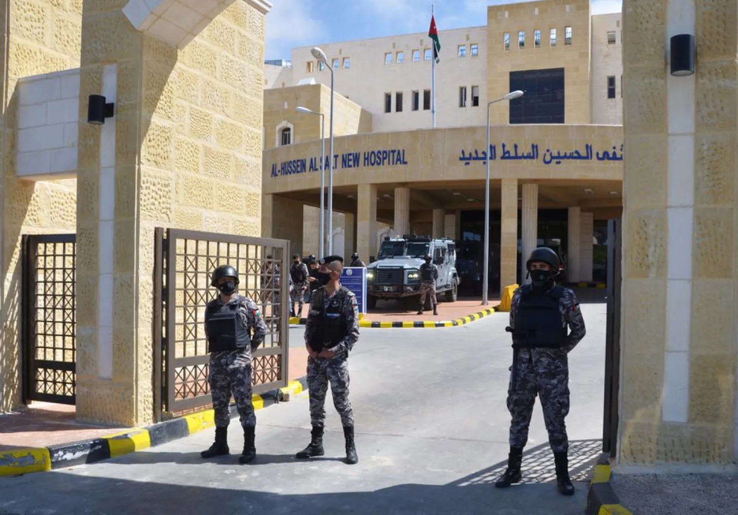 Gendarmerie officers stand guard at the gate of the new Salt government hospital in the city of Salt, Jordan March 13, 2021. (Reuters)