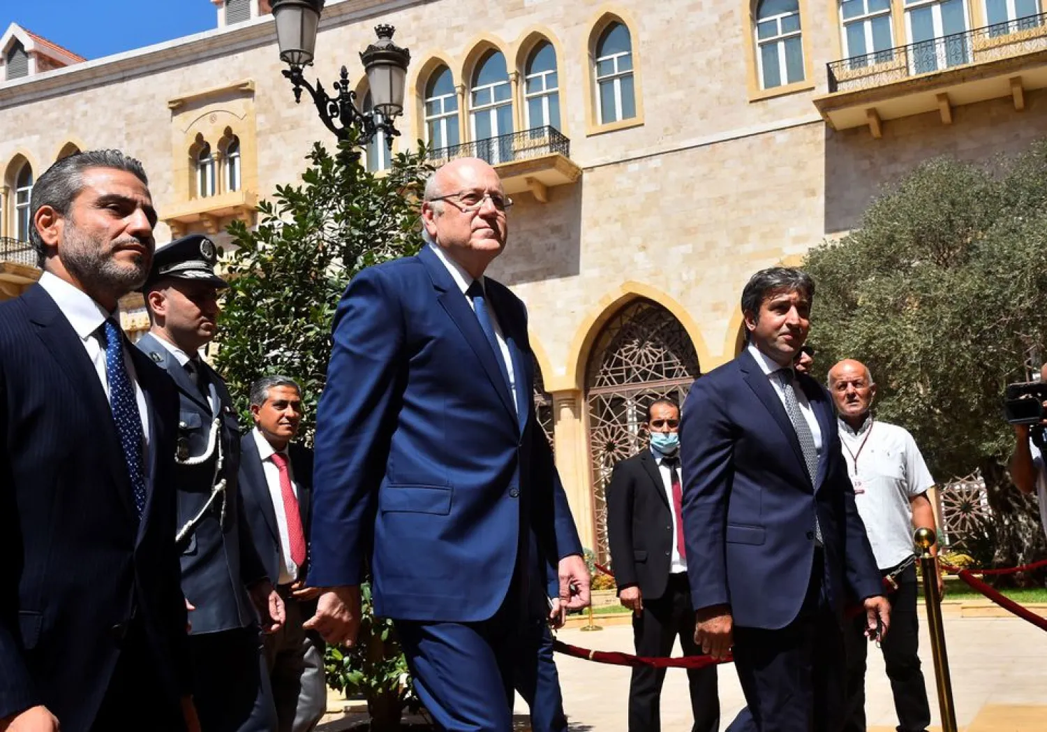 Lebanon's new Prime Minister Najib Mikati walks during an official ceremony to mark his assumption of duties at the Government Palace in Beirut, Lebanon September 13, 2021. (Dalati & Nohra)