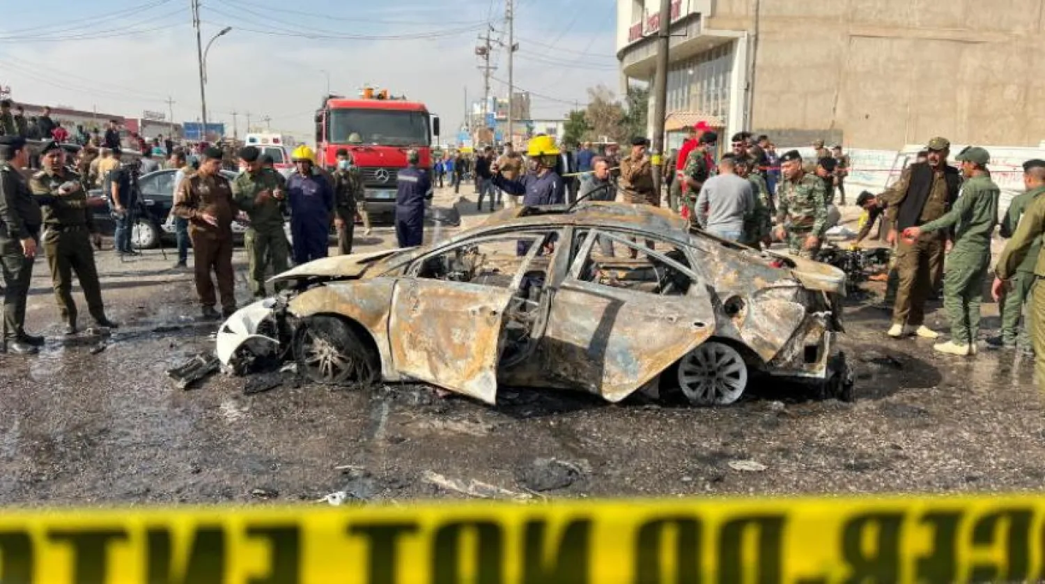 Iraqi security forces inspect the site of an explosion in Basra, Iraq December 7, 2021. REUTERS