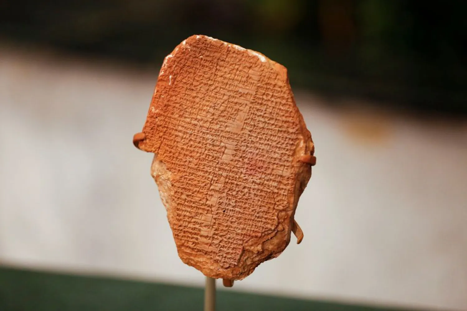 The Gilgamesh Dream Tablet, stolen from Iraq in 1991 and returned to Iraq after it was seized by the US government, is displayed at the Ministry of Foreign Affairs in Baghdad, Iraq December 7, 2021. (Reuters)