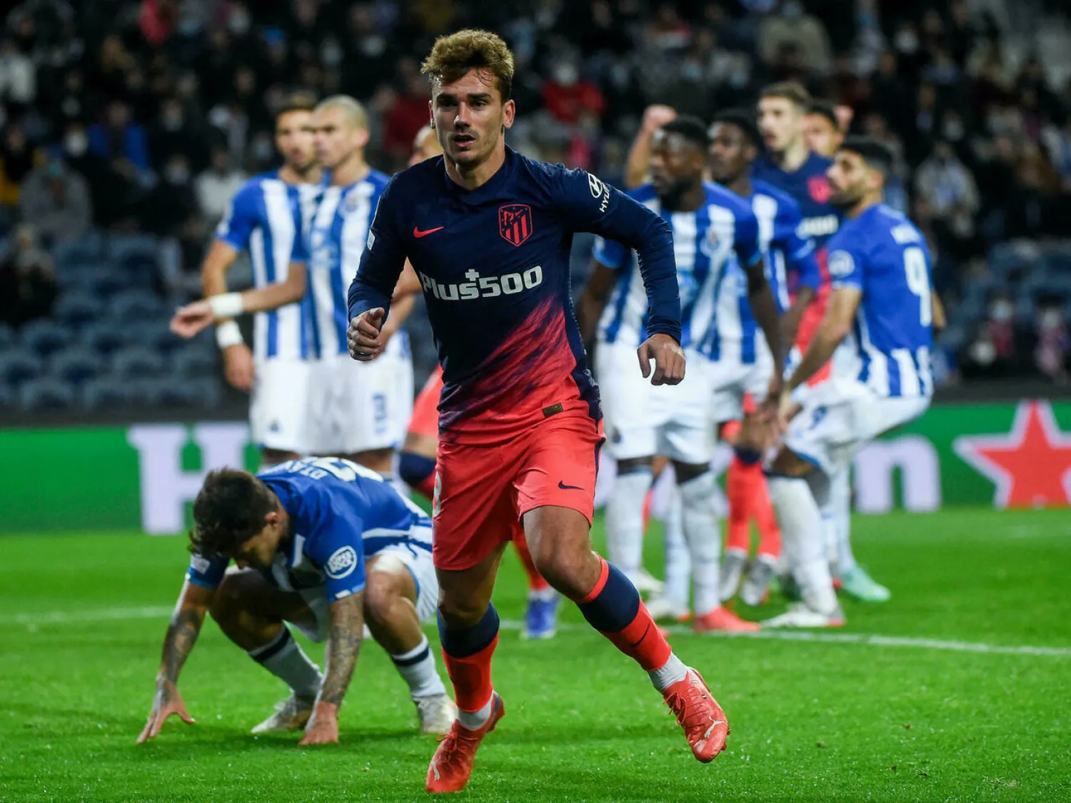 Antoine Griezmann got the opener as Atletico Madrid beat Porto to qualify for the Champions League last 16 MIGUEL RIOPA AFP
