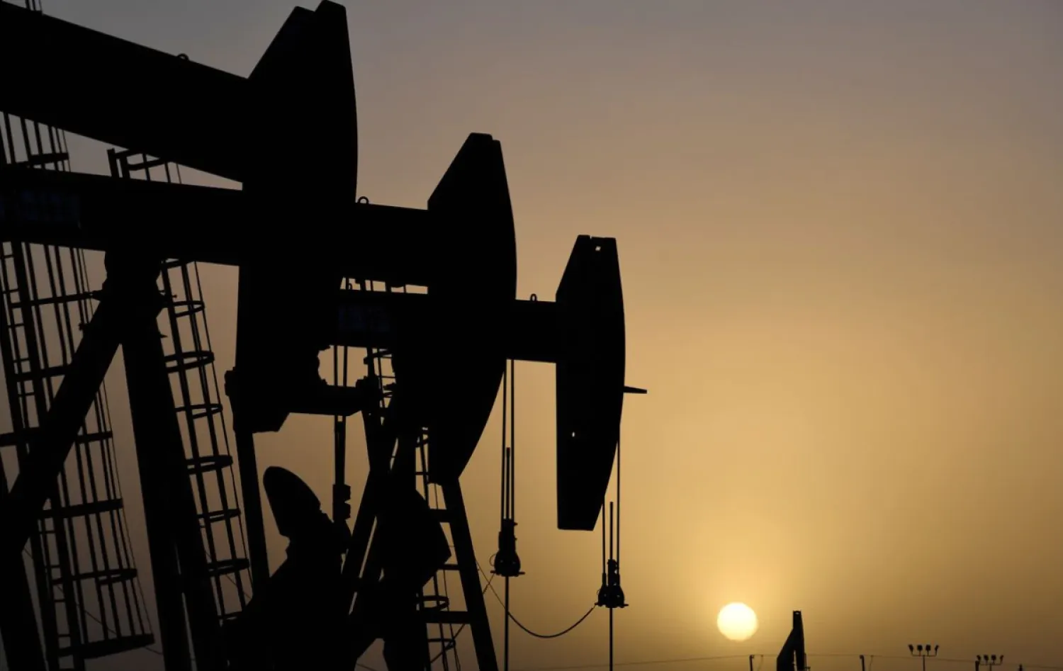 Pump jacks operate at sunset in Midland, Texas, US, February 11, 2019. REUTERS/Nick Oxford