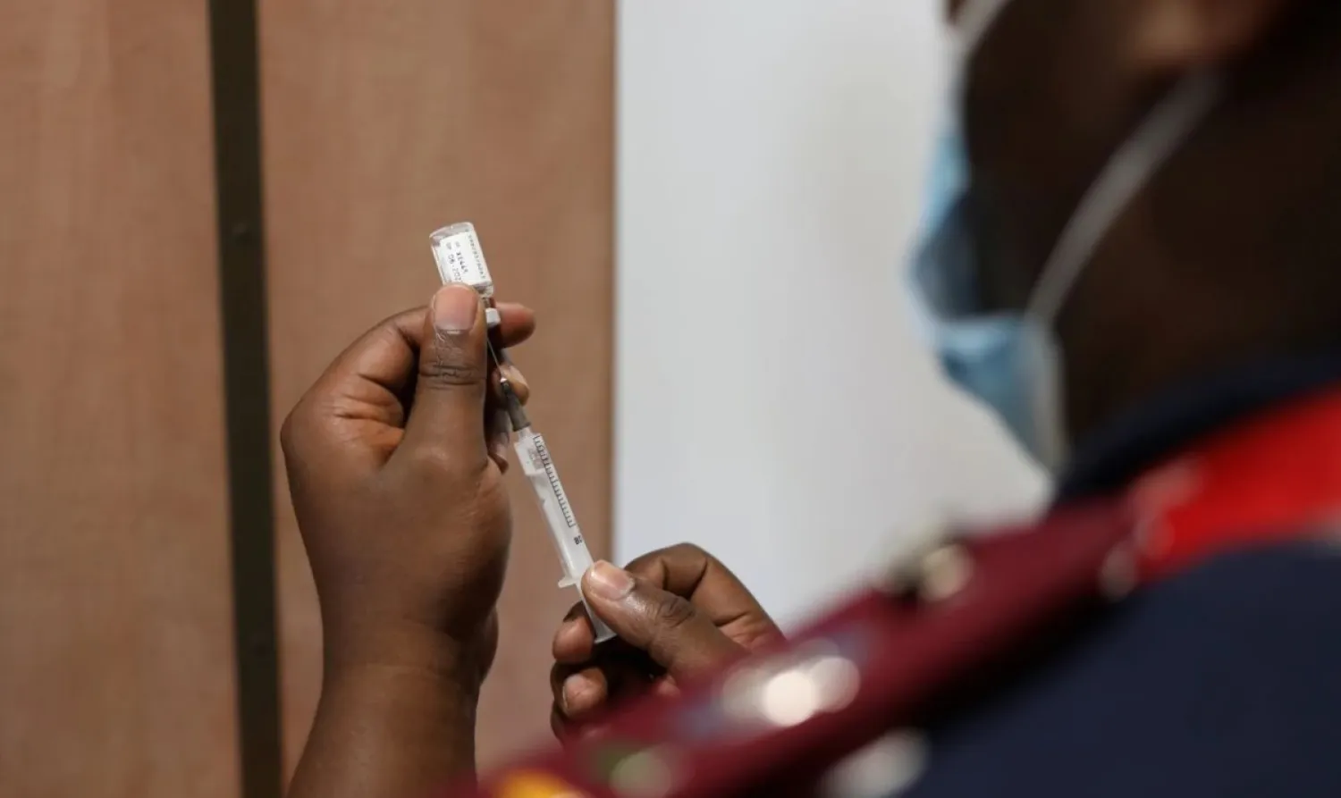 A nurse prepares a dose of the coronavirus disease (COVID-19) vaccine as the new Omicron variant spreads, in Dutywa, in the Eastern Cape province, South Africa November 29, 2021. REUTERS/Siphiwe Sibeko