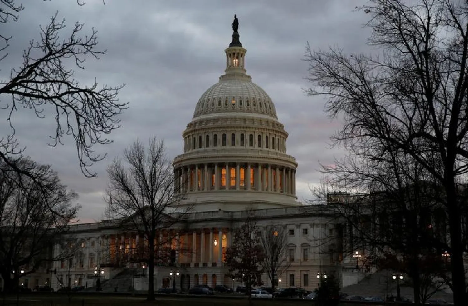  The US Capitol building is lit at dusk ahead of planned votes on tax reform in Washington, U.S., December 18, 2017. REUTERS/Joshua Roberts