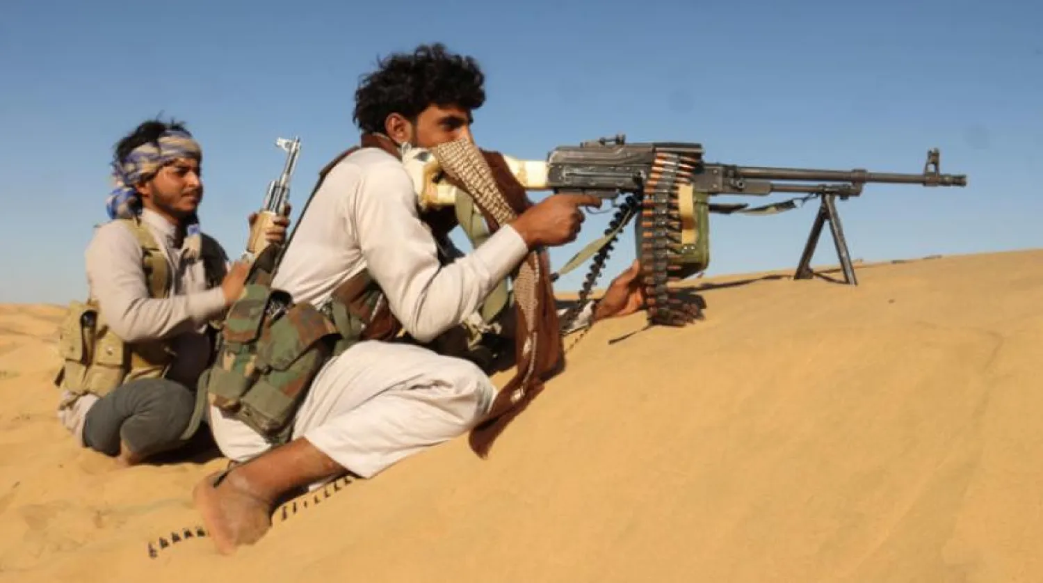  Two Yemeni National Army soldiers in a desert site near Marib. (Reuters) 

