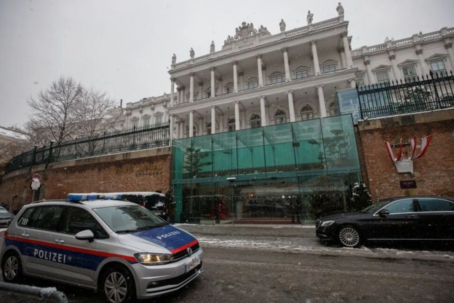 A police car drives past Palais Coburg, the site of a meeting of the Joint Comprehensive Plan of Action (JCPOA), in Vienna, Austria, December 9, 2021. (Reuters)