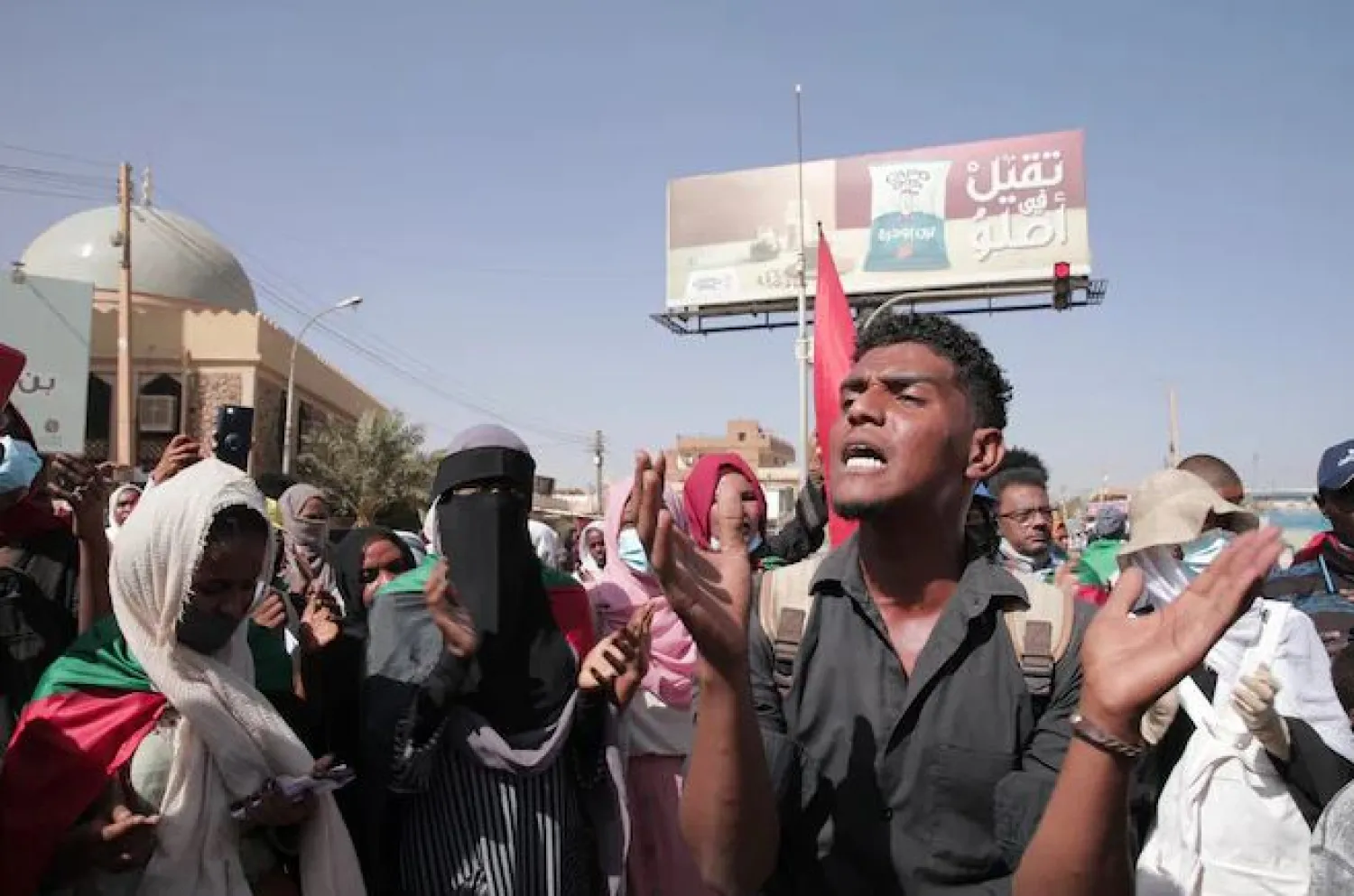 People protests against the October military coup and subsequent deal that reinstated Prime Minister Abdalla Hamdok in Khartoum, Sudan, Monday, Dec. 13, 2021. (AP Photo/Marwan Ali)
