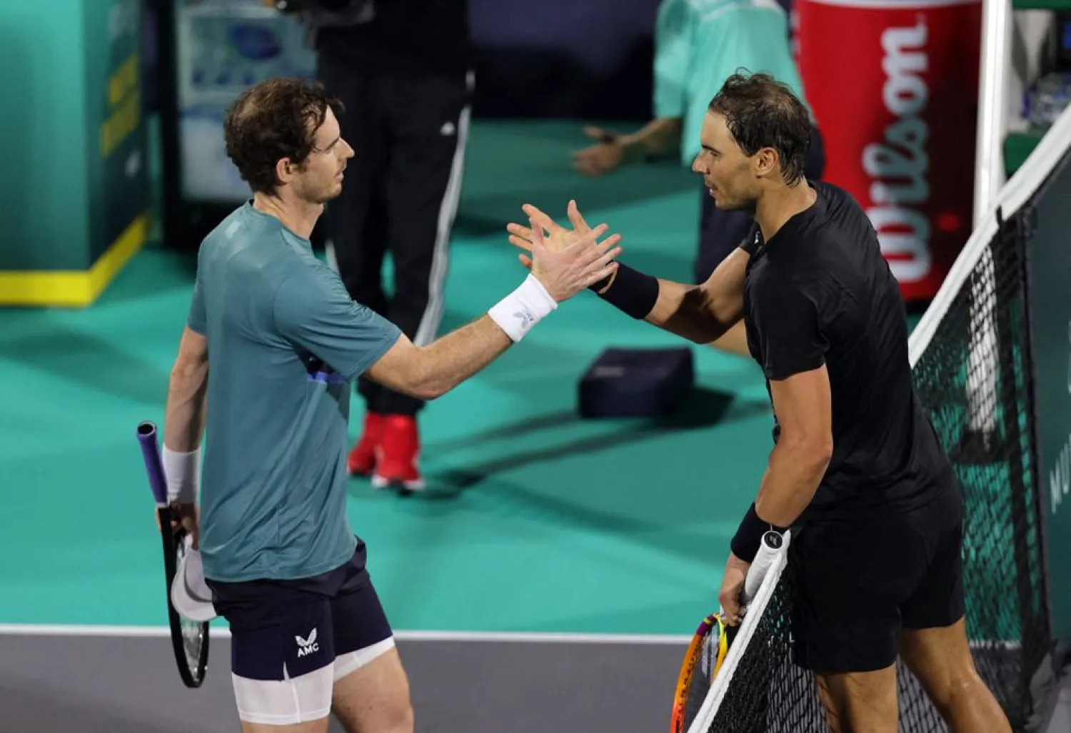 Tennis - Mubadala World Tennis Championship - International Tennis Centre, Zayed Sports City, Abu Dhabi, United Arab Emirates - December 17, 2021 Britain's Andy Murray shakes hands with Spain's Rafael Nadal after winning their semi final match REUTERS/Christopher Pike