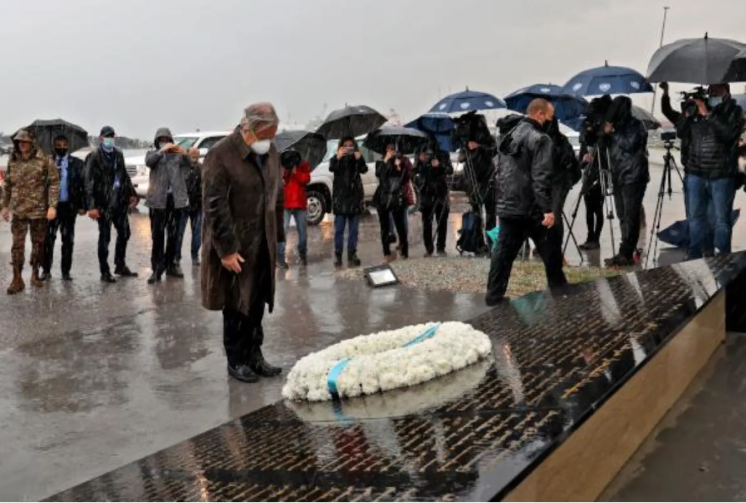 UN Secretary-General Antonio Guterres lays a wreath on December 20, 2021, at the site of the August 4, 2020 port explosion that ravaged the Lebanese capital Beirut. (Photo by anwar amro / AFP)
