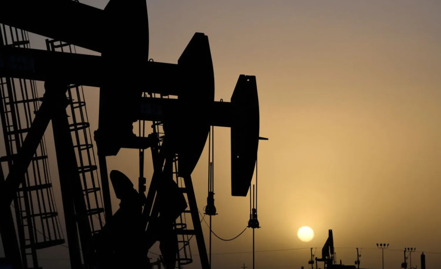 Pump jacks operate at sunset in Midland, Texas, US, February 11, 2019. REUTERS/Nick Oxford