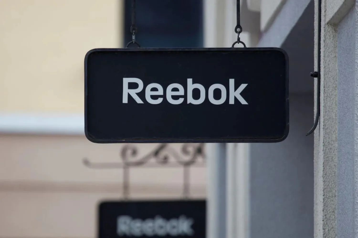 Boards with Reebok store logo are seen on a shopping center at the outlet village Belaya Dacha outside Moscow, Russia, April 23, 2016. REUTERS/Grigory Dukor/File Photo

