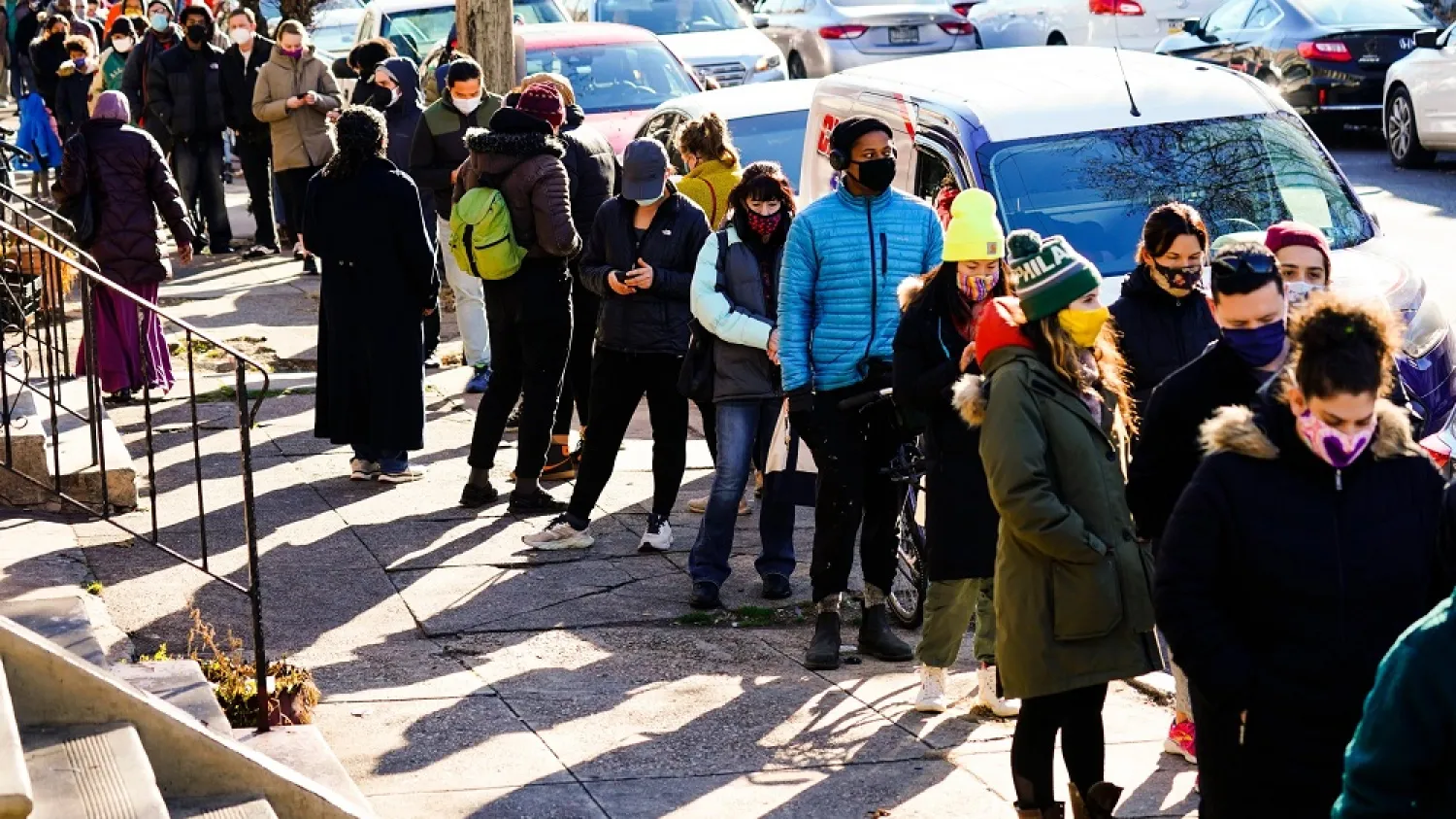 City residents wait in a line extending around the block to receive free at-home rapid COVID-19 test kits in Philadelphia, Monday, Dec. 20, 2021. (AP)