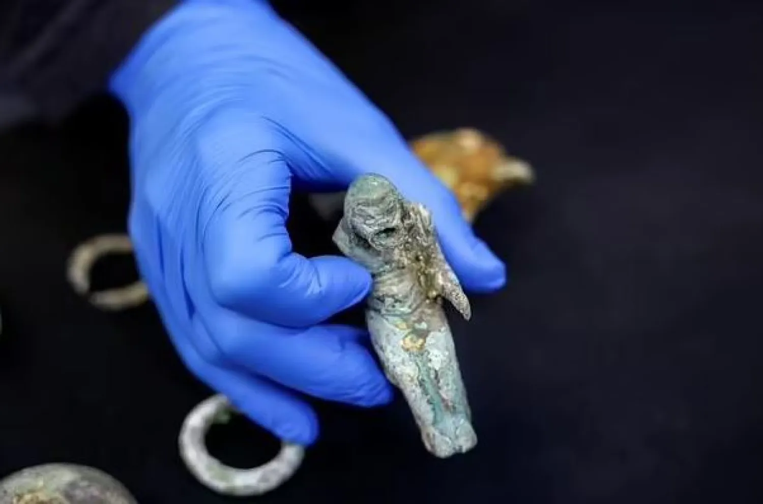 An ancient figurine of a Roman pantomimus recovered from off the coast of Caesarea - AFP