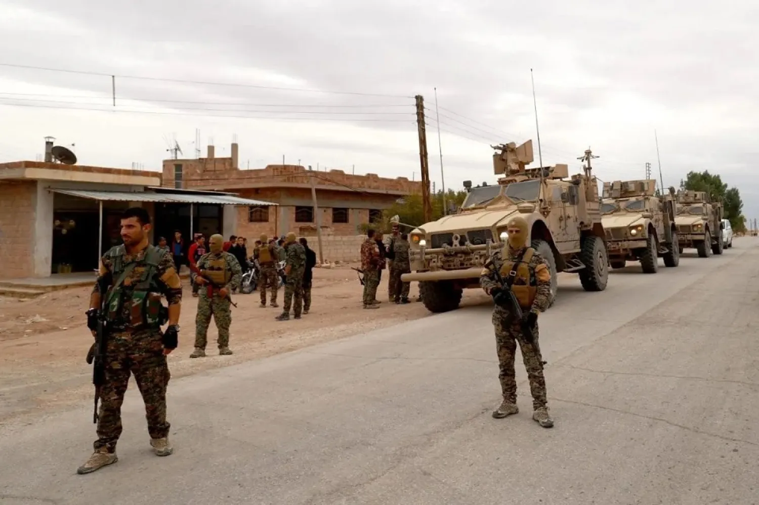 US forces and members of the Syrian Democratic Forces (SDF) patrol the Kurdish-held town of Al-Darbasiyah in northeastern Syria bordering Turkey on November 4, 2018. (Getty Images)