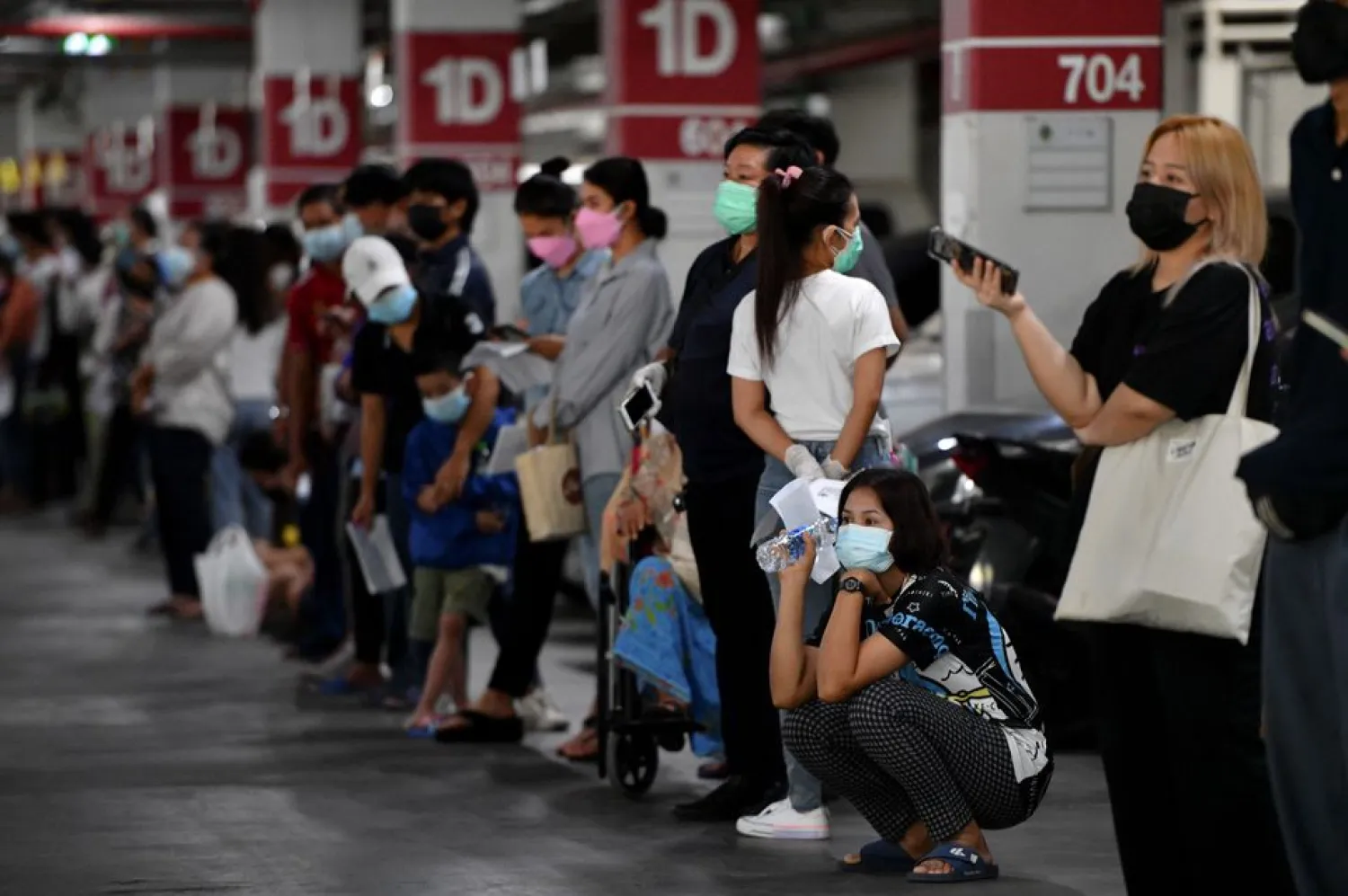 People queue for free coronavirus disease (COVID-19) rapid antigen tests at a mass testing station, as the spread of COVID-19 continues, in Bangkok, Thailand, July 15, 2021. REUTERS/Chalinee Thirasupa