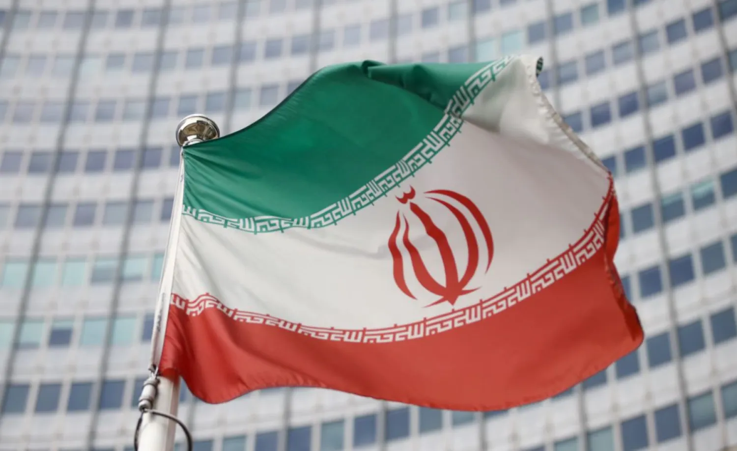 The Iranian flag waves in front of the International Atomic Energy Agency (IAEA) headquarters, before the beginning of a board of governors meeting, amid the coronavirus disease (COVID-19) outbreak in Vienna, Austria, March 1, 2021. REUTERS/Lisi Niesner/File Photo
