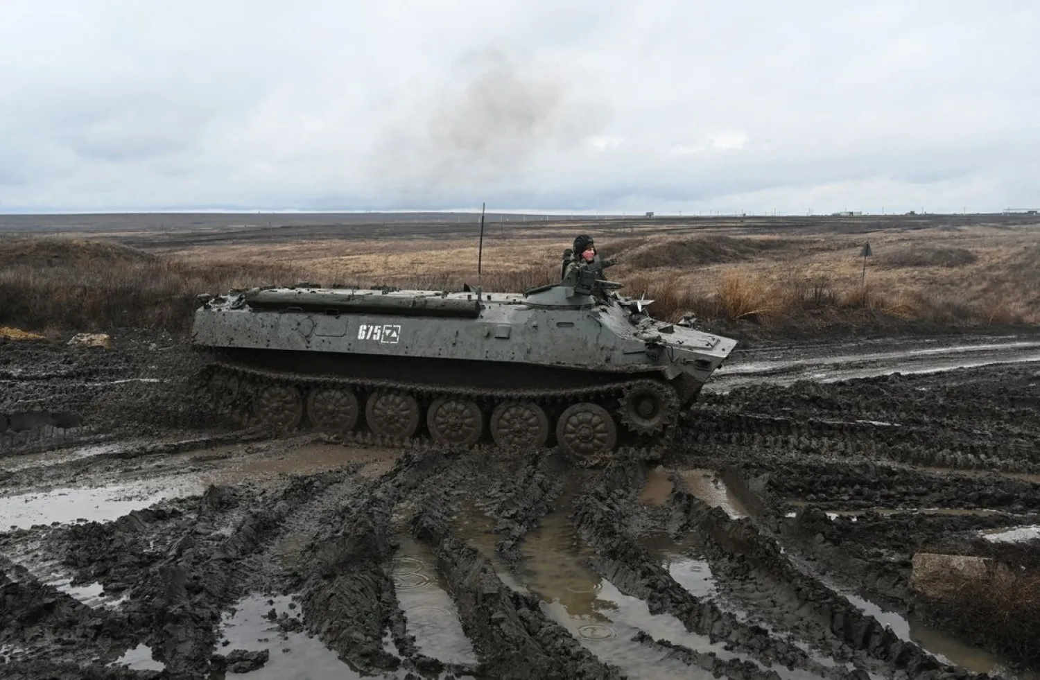 A Russian service member drives a MT-LB multi-purpose amphibious armoured carrier during military drills at the Kadamovsky range in the Rostov region, Russia December 20, 2021. (Reuters)