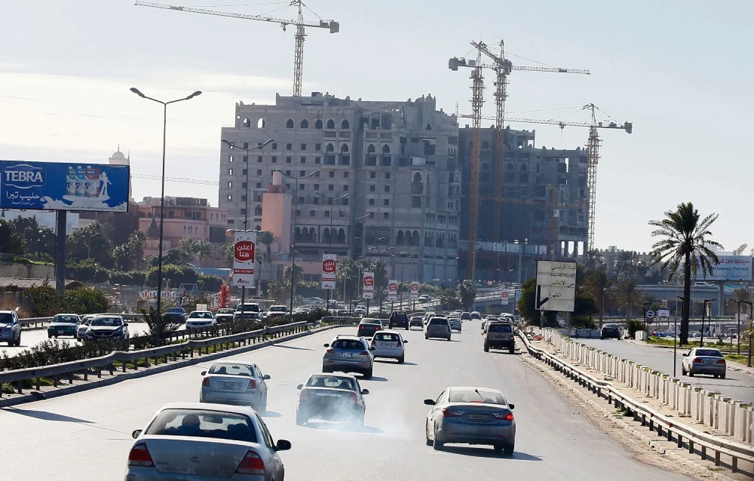Libyans commute on a highway in the capital Tripoli, Libya, Feb. 3, 2020. (AFP)