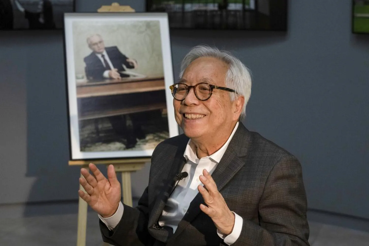 The AP Moscow photo chief, Liu Heung Shing, who was the only foreign photographer who captured Soviet President Mikhail Gorbachev's resignation on Dec. 25, 1991 that marked the end of the USSR, gestures during an interview with the Associated Press at the Shanghai Center of Photography in Shanghai, China on Thursday, Dec. 16, 2021. (AP)