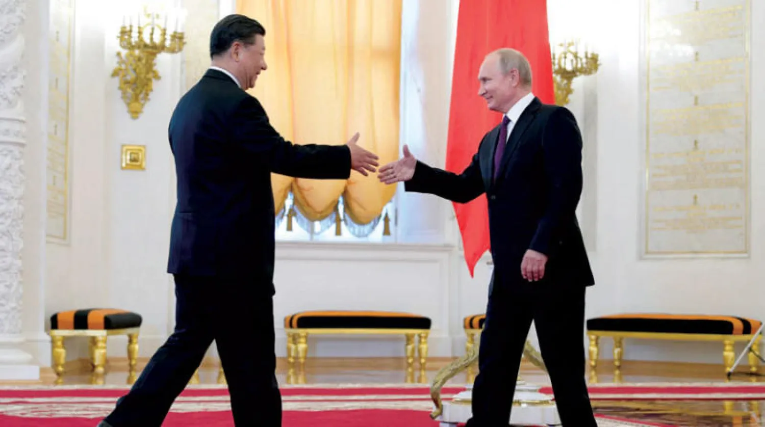 الرئيسان فلاديمير بوتين وشي جين بينج يتحدثان هاتفياً بصفة شهرية (أ.ب)