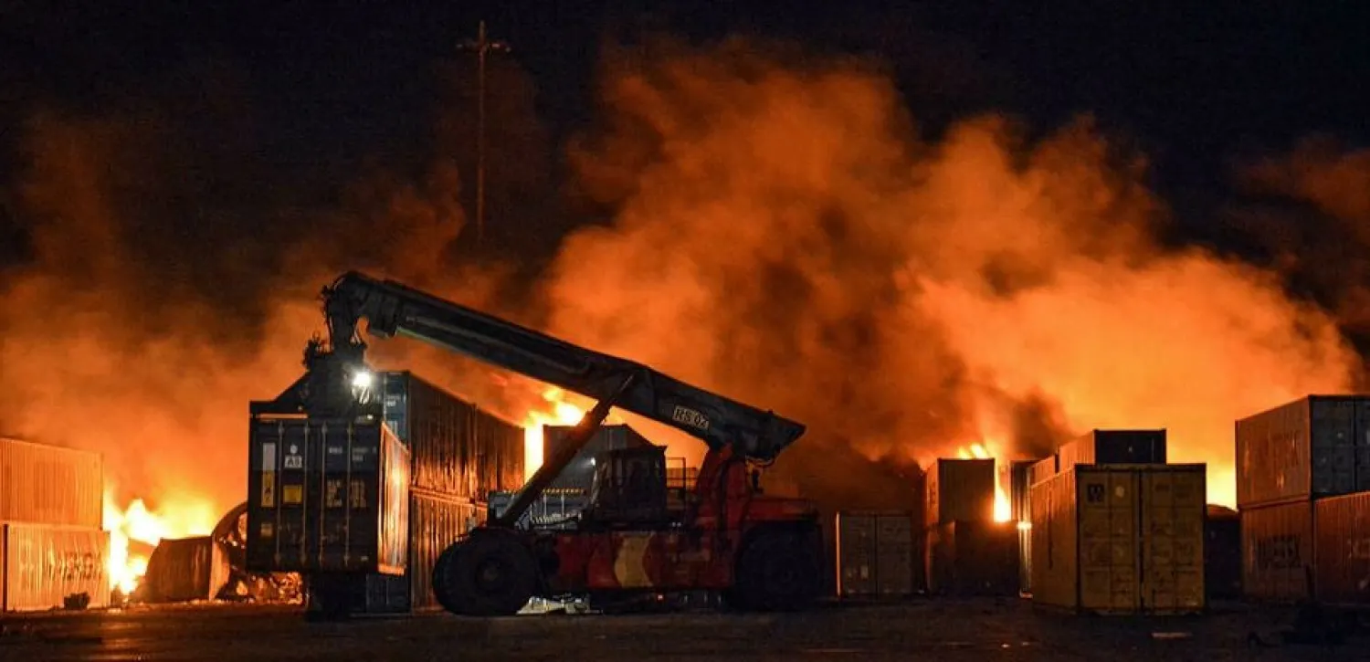 Firefighters battle the huge blaze sparked by an Israeli air strike on the container yard of the Syrian port of Latakia - SANA/AFP
