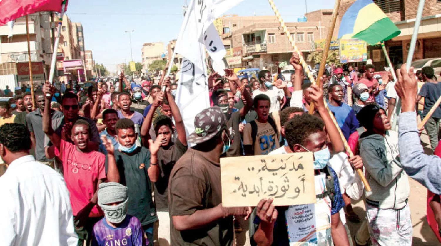مسيرات في شوارع الخرطوم يوم 30 ديسمبر (أ.ف.ب)