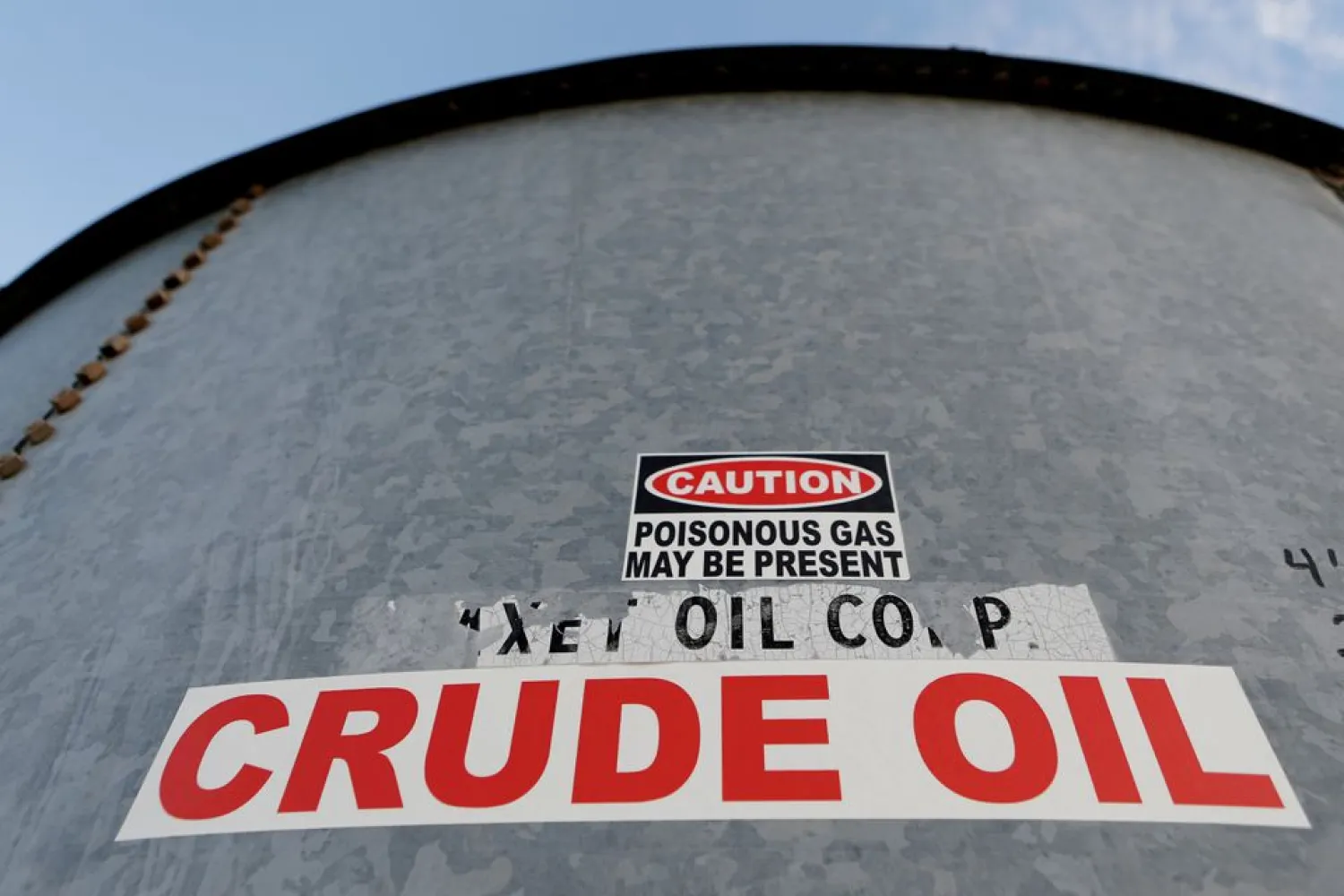 A sticker reads crude oil on the side of a storage tank in the Permian Basin in Mentone, Loving County, Texas, US November 22, 2019. REUTERS/Angus Mordant