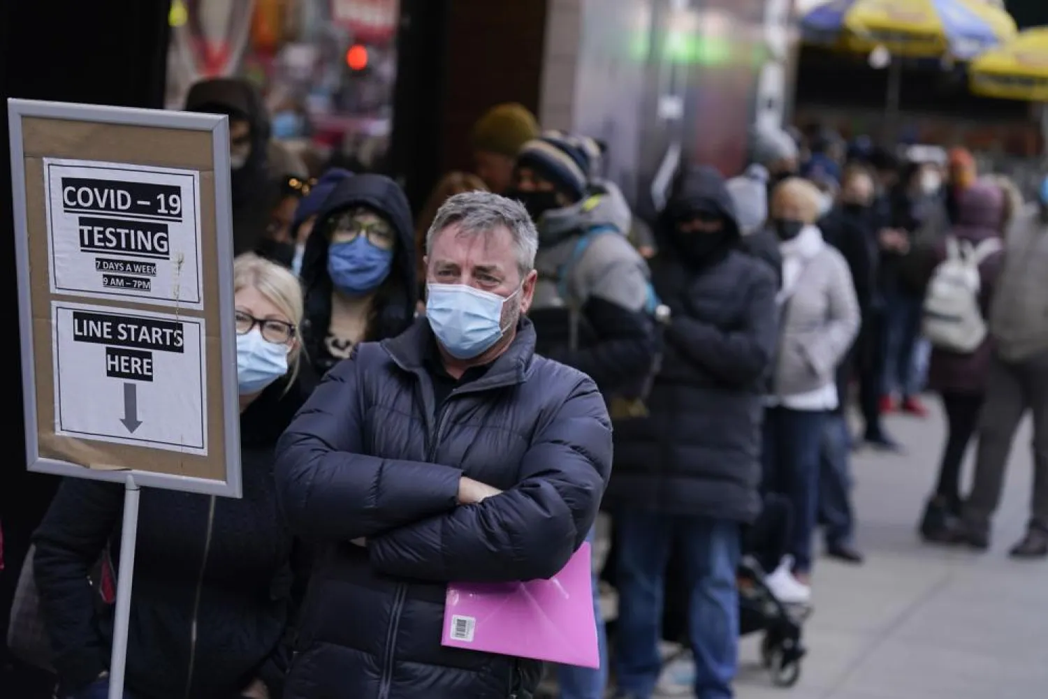 People wait in line at a COVID-19 testing site in New York's Times Square on Dec. 13, 2021. (AP)