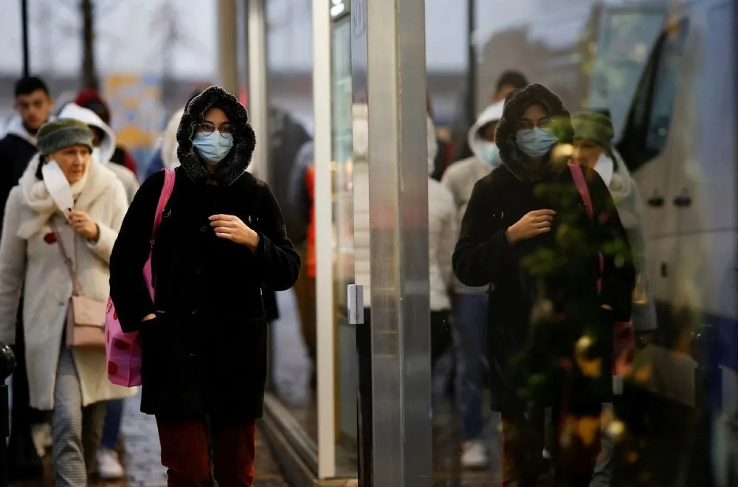 People wearing face masks walk in Nantes amid the coronavirus disease (COVID-19) outbreak in France, December 9, 2021. (Reuters)