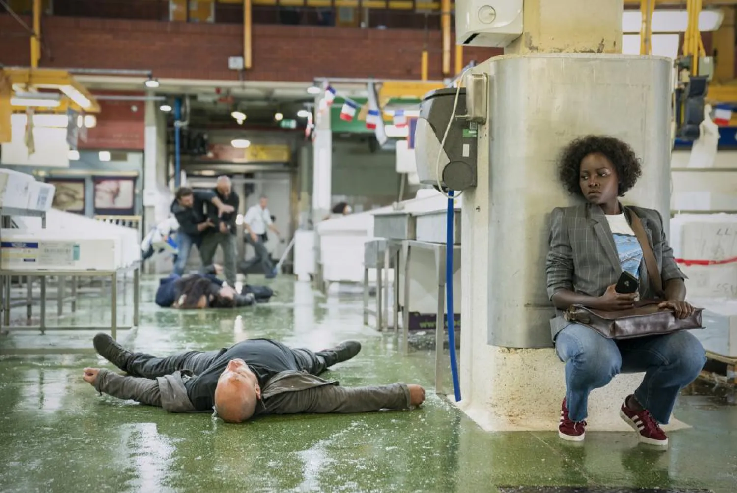 This image provided by Universal Pictures shows Lupita Nyong'o as Khadijah in a scene from "The 355', co-written and directed by Simon Kinberg. (Universal Pictures via AP)