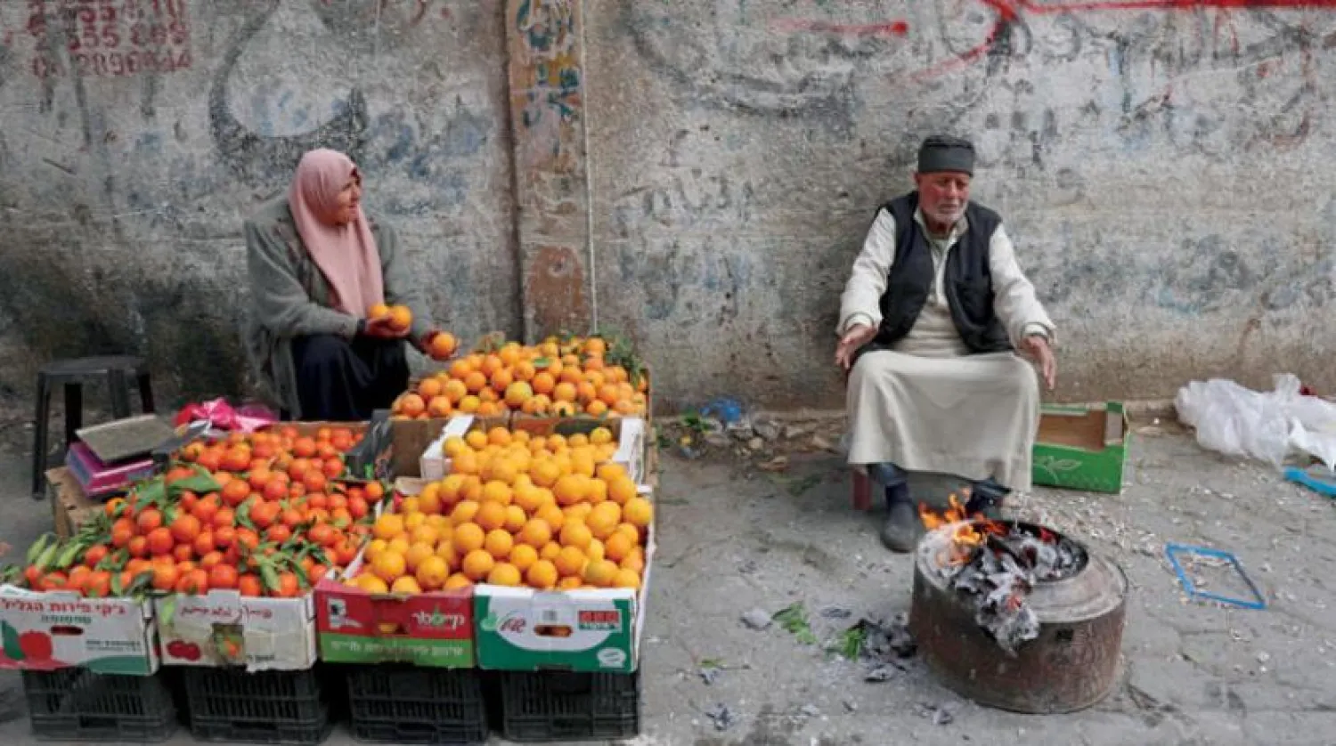Vendors wait of customers in Gaza on Wednesday. (AFP)