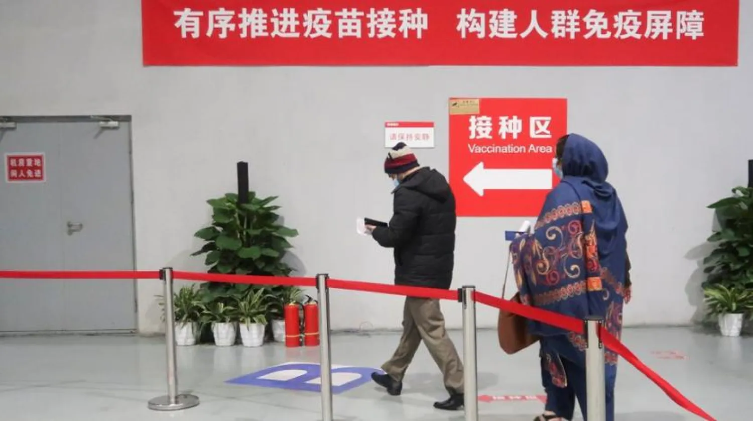 People arrive to get a vaccine against the coronavirus disease (COVID-19) at a vaccination center, during a government-organized visit, in Beijing, China, April 15, 2021. REUTERS/Thomas Peter

