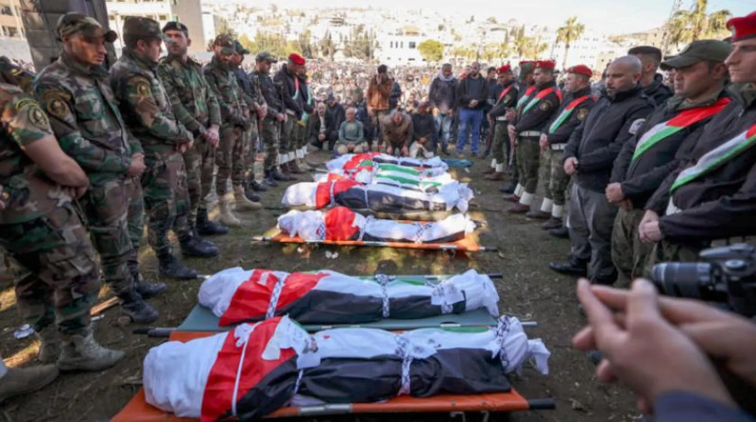 Palestinians in Aqraba, in eastern Nablus in the West Bank, attend Friday the funeral of eight workers who were killed in a traffic accident in the Jordan Valley. (AFP)
