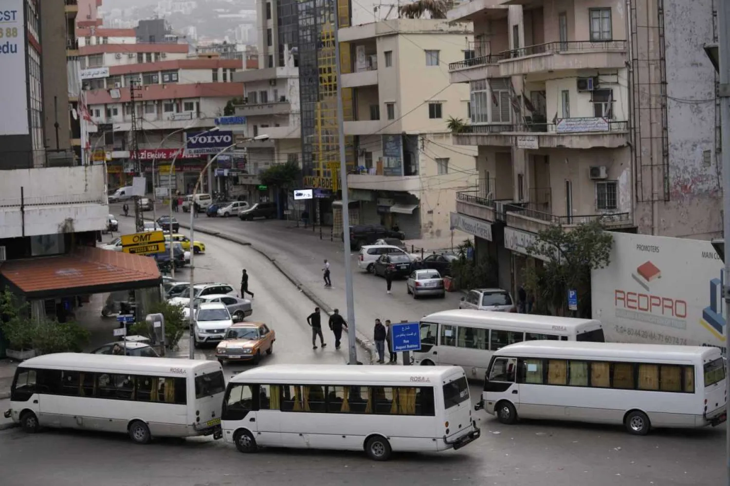 Public transport buses block a road, during a general strike by public transport and labor unions to protest the country's deteriorating economic and financial conditions in Beirut, Lebanon, Thursday, Jan. 13, 2022. Hussein Malla/AP