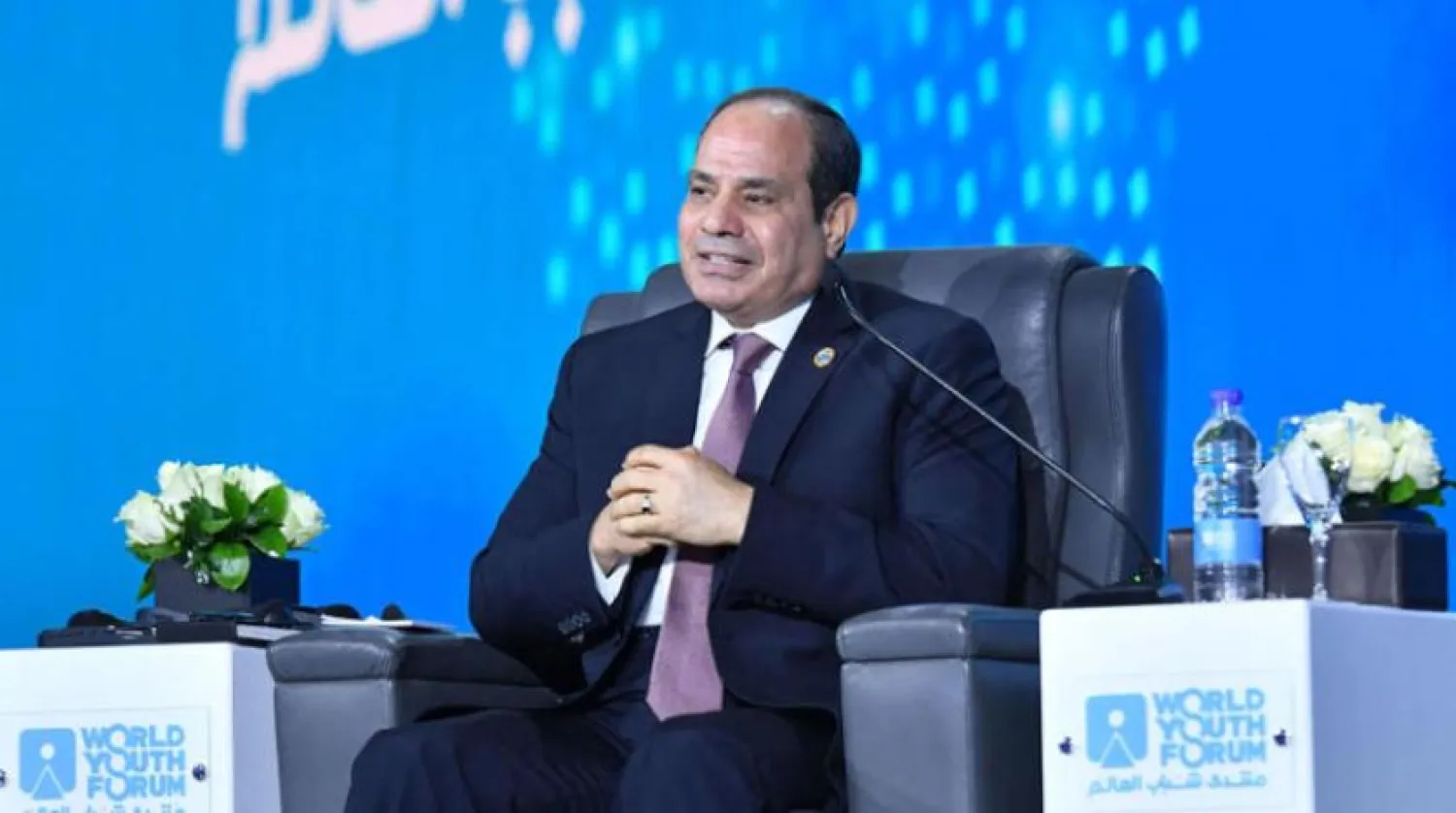 A handout picture released by the Egyptian Presidency on January 10, 2022, shows Egyptian President Abdel Fattah al-Sisi speaking during the opening of the World Youth Forum in the Egyptian Red Sea resort of Sharm el-Sheikh. (Photo by EGYPTIAN PRESIDENCY / AFP) 