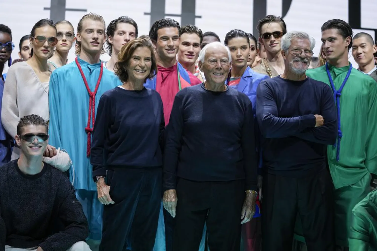 Silvana Armani from center left, Giorgio Armani and Leo Dell'Orco stand with models after the Emporio Armani Spring Summer 2022 collection during Milan Fashion Week, in Milan, Italy, Thursday, Sept. 23, 2021. (AP Photo/Luca Bruno)
