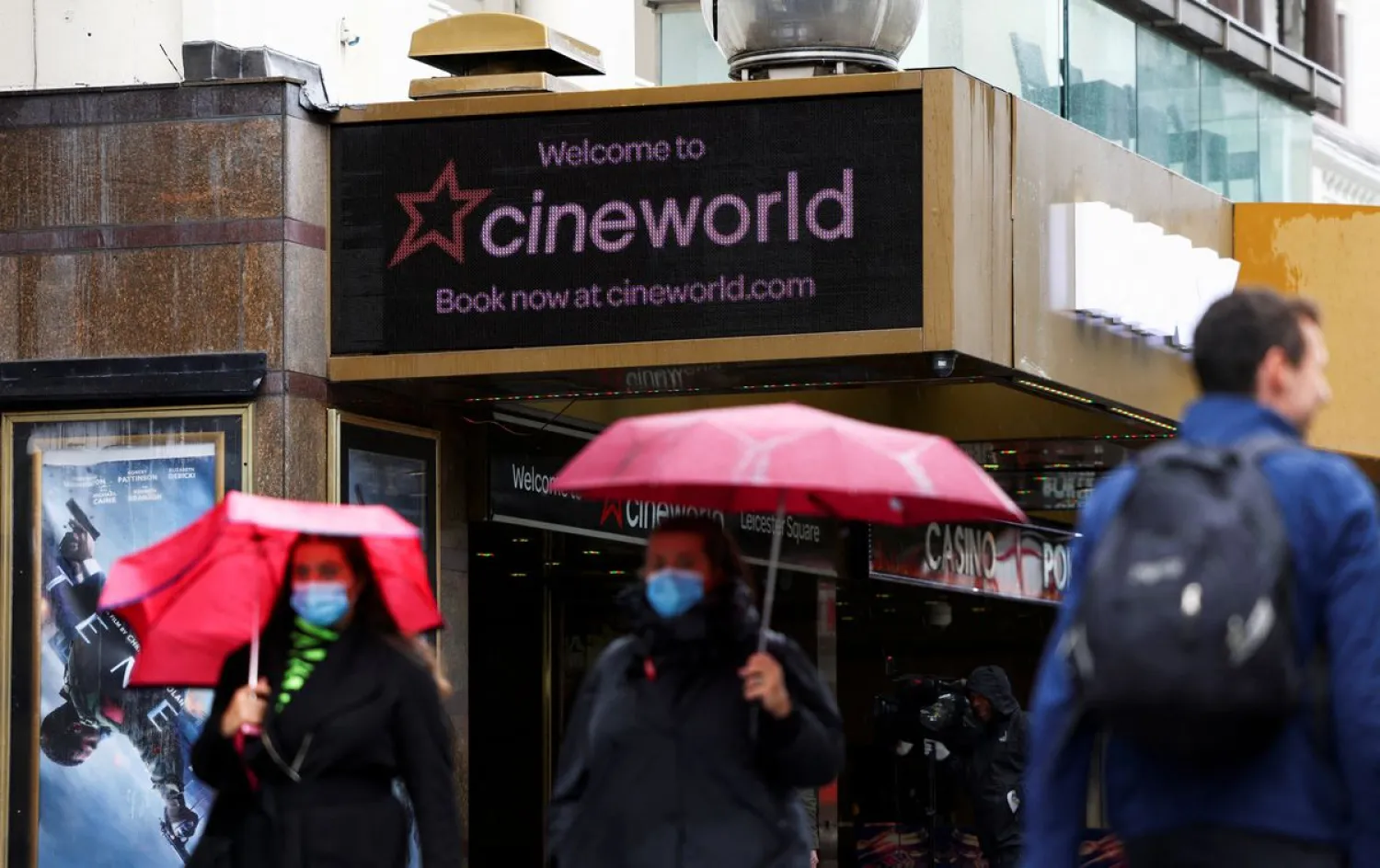 People walk past a Cineworld in Leicester's Square, amid the coronavirus disease (COVID-19) outbreak in London, Britain, October 4, 2020. (Reuters)