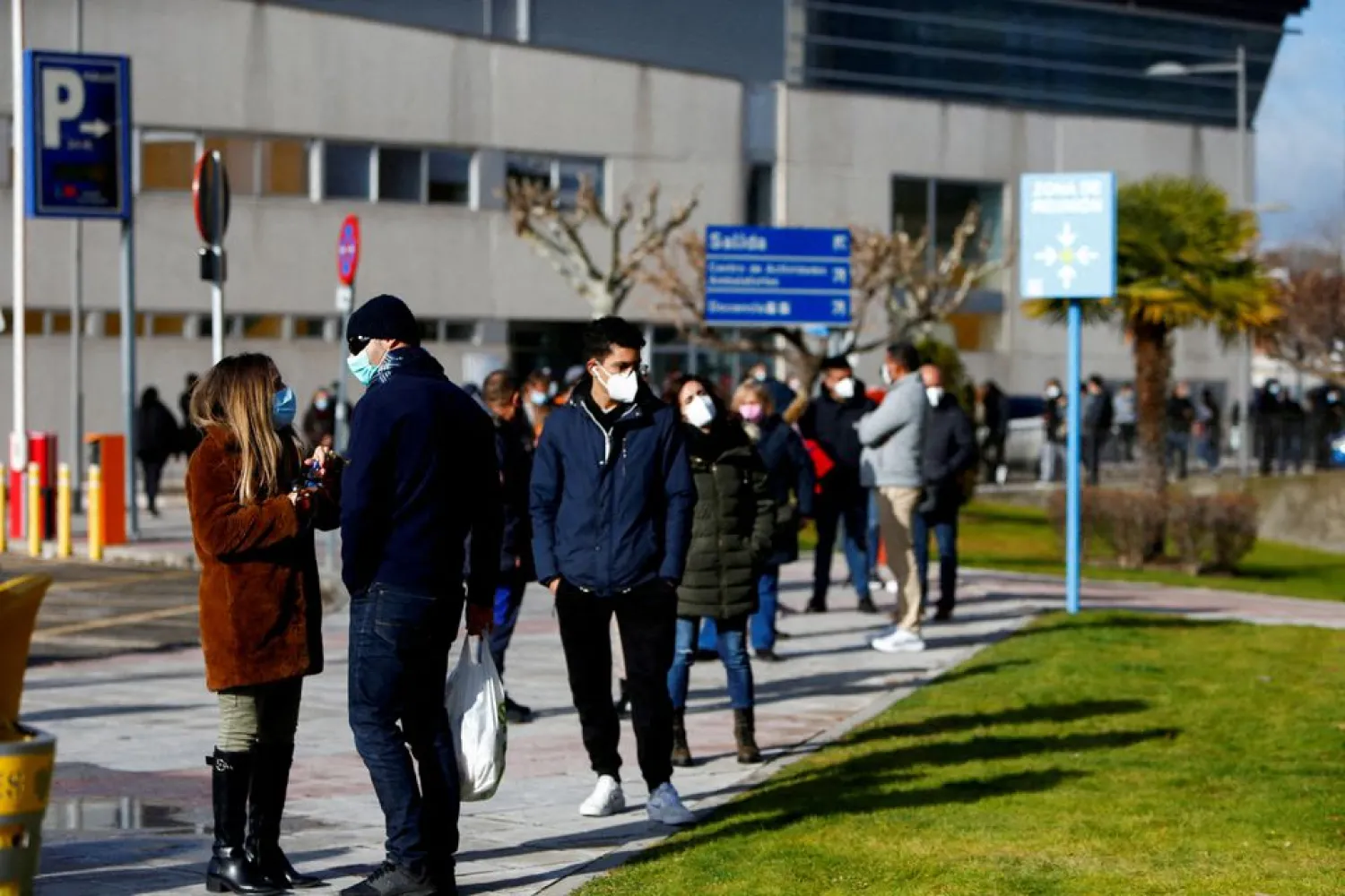 People queue to get tested for the coronavirus disease (COVID-19) after the Christmas holiday break, amid the COVID-19 pandemic, at Doce de Octubre Hospital in Madrid, Spain December 27, 2021. (Reuters)