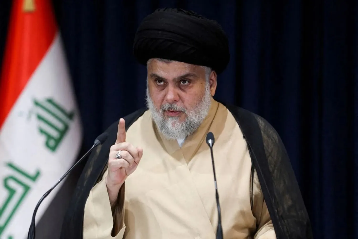 Cleric Moqtada al-Sadr speaks after preliminary results of Iraq's parliamentary election were announced in Najaf, Iraq October 11, 2021. (Reuters)