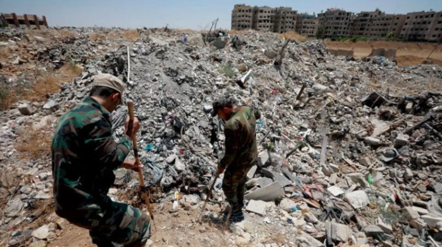 Şam'ın Doğu Guta bölgesindeki Meliha kasabasında, 2019’un yaz aylarında patlamamış mühimmatlar arandı. (Getty)