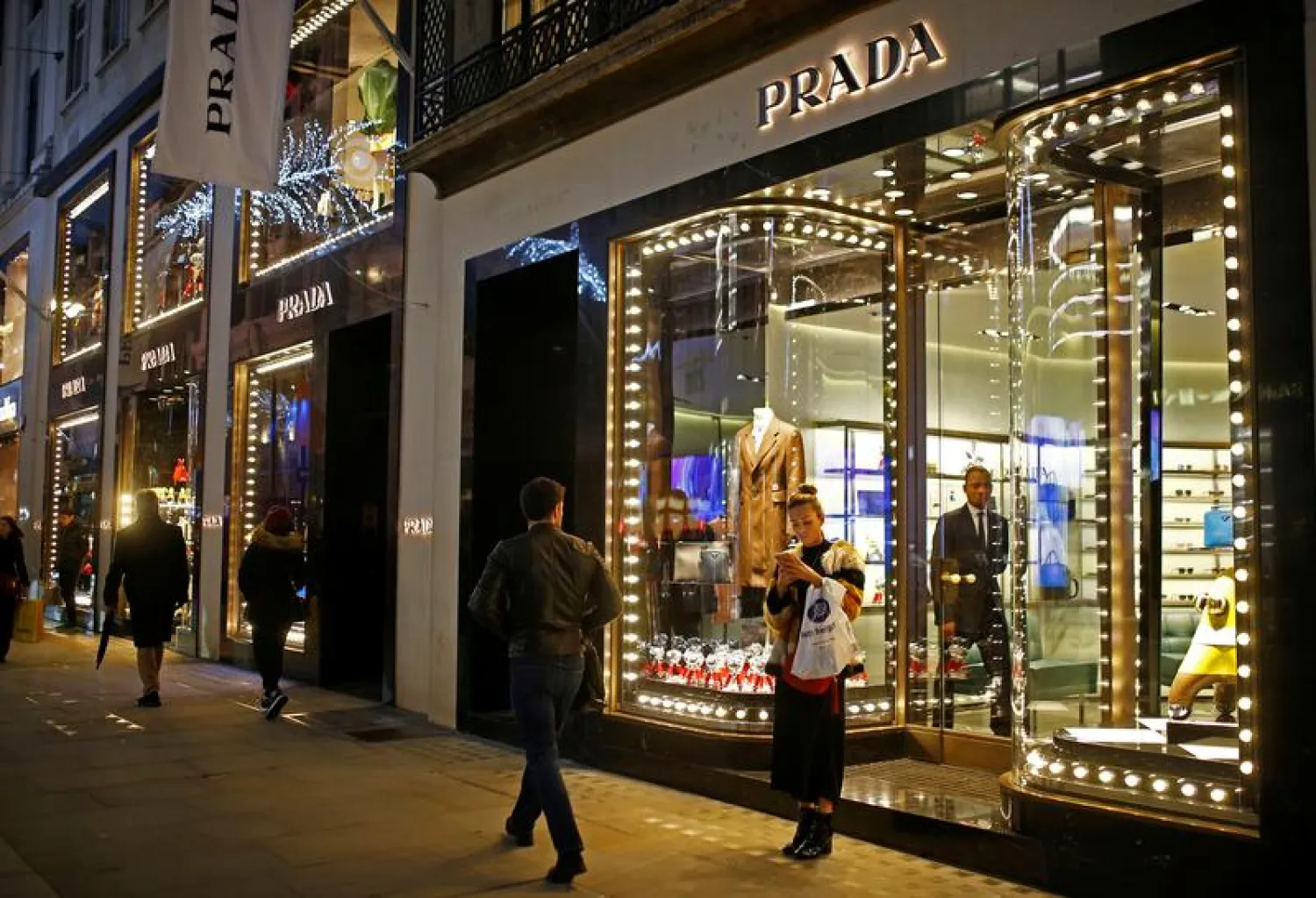Festive lights decorate the Prada store on New Bond Street as shoppers do Christmas shopping in central London, Britain, December 16, 2018. (Reuters)