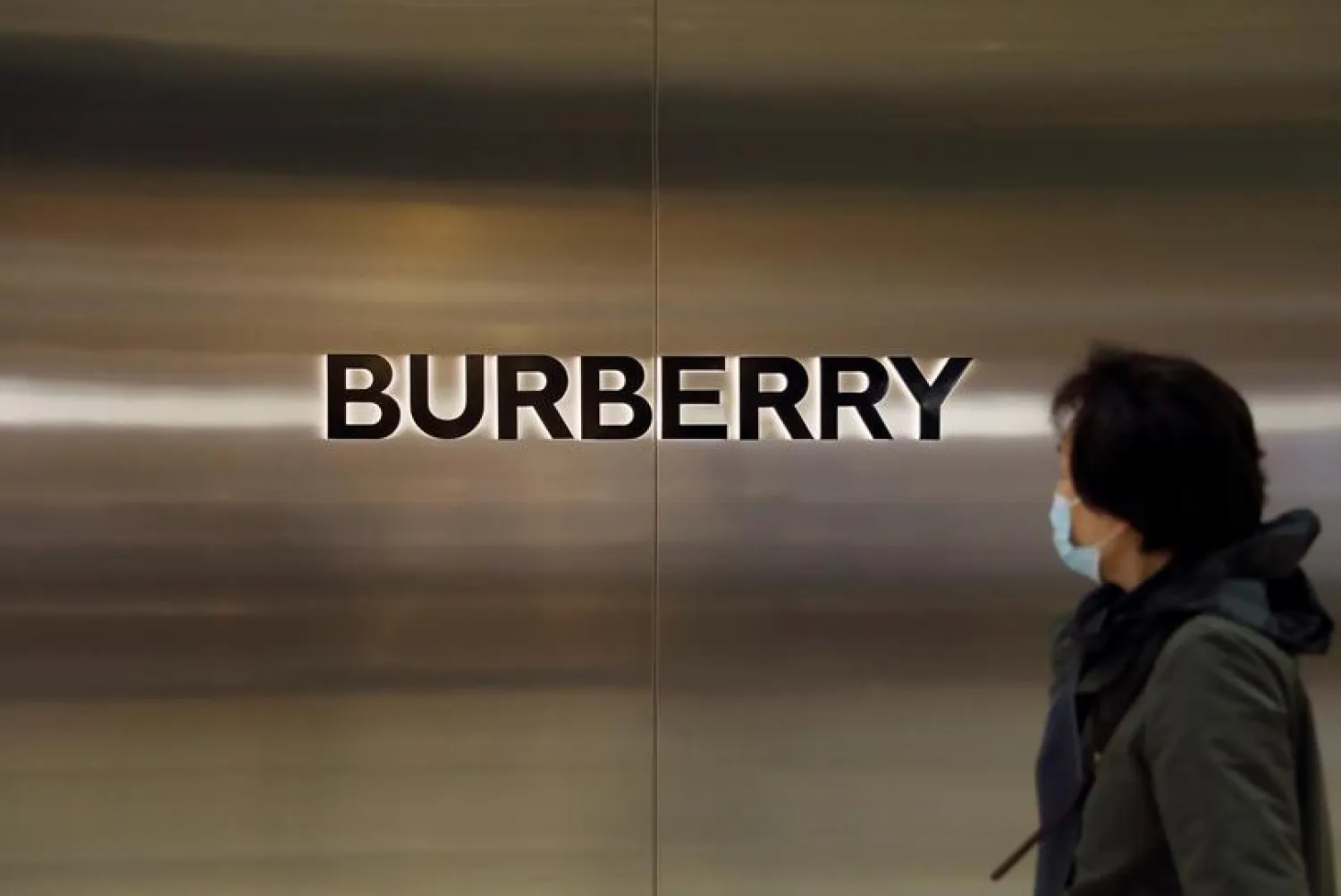 A woman walks past a store of luxury brand Burberry at a shopping mall in Beijing, China March 26, 2021. (Reuters)