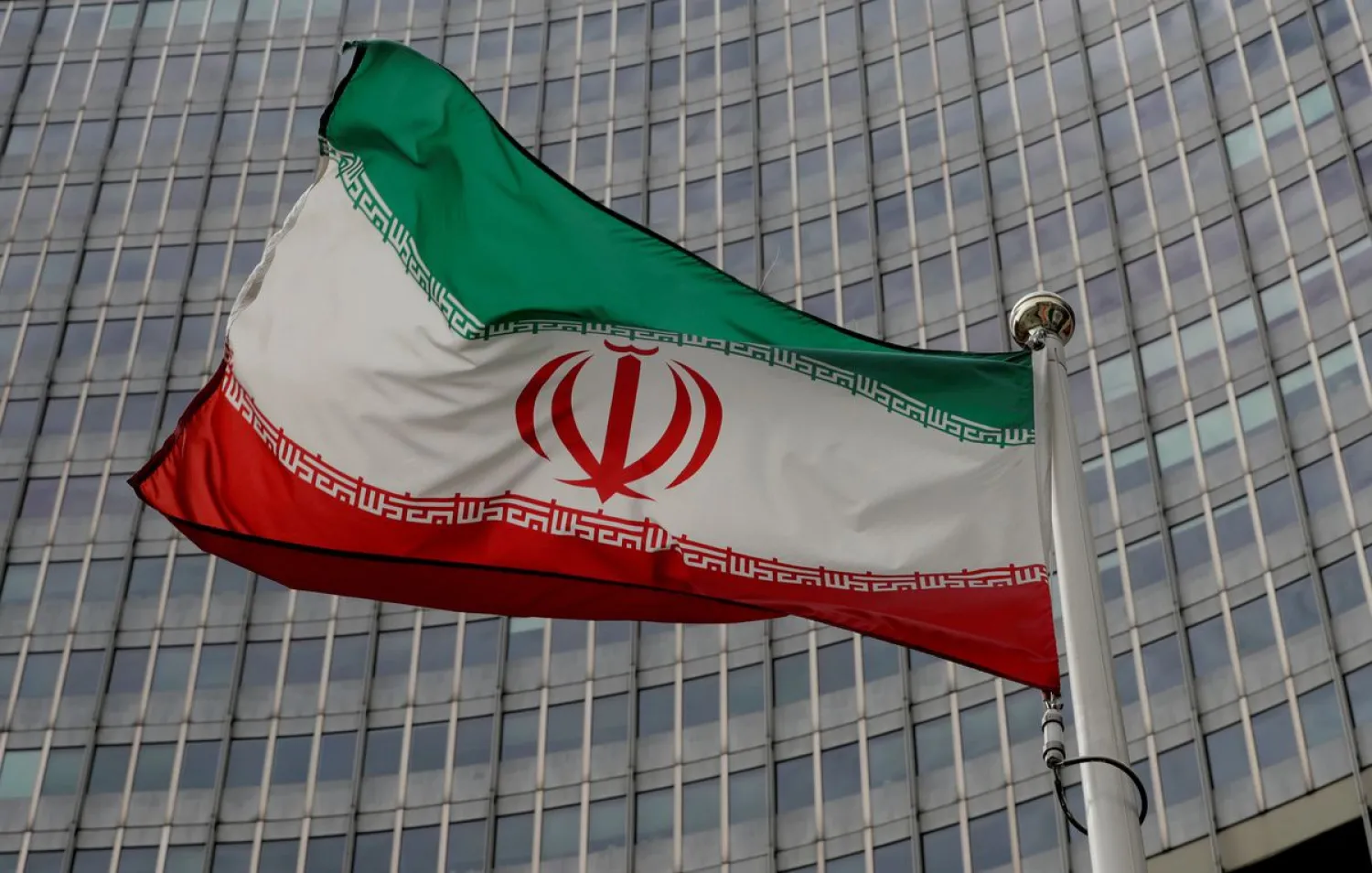 An Iranian flag flutters in front of the International Atomic Energy Agency (IAEA) headquarters in Vienna, Austria, September 9, 2019. REUTERS/Leonhard Foeger