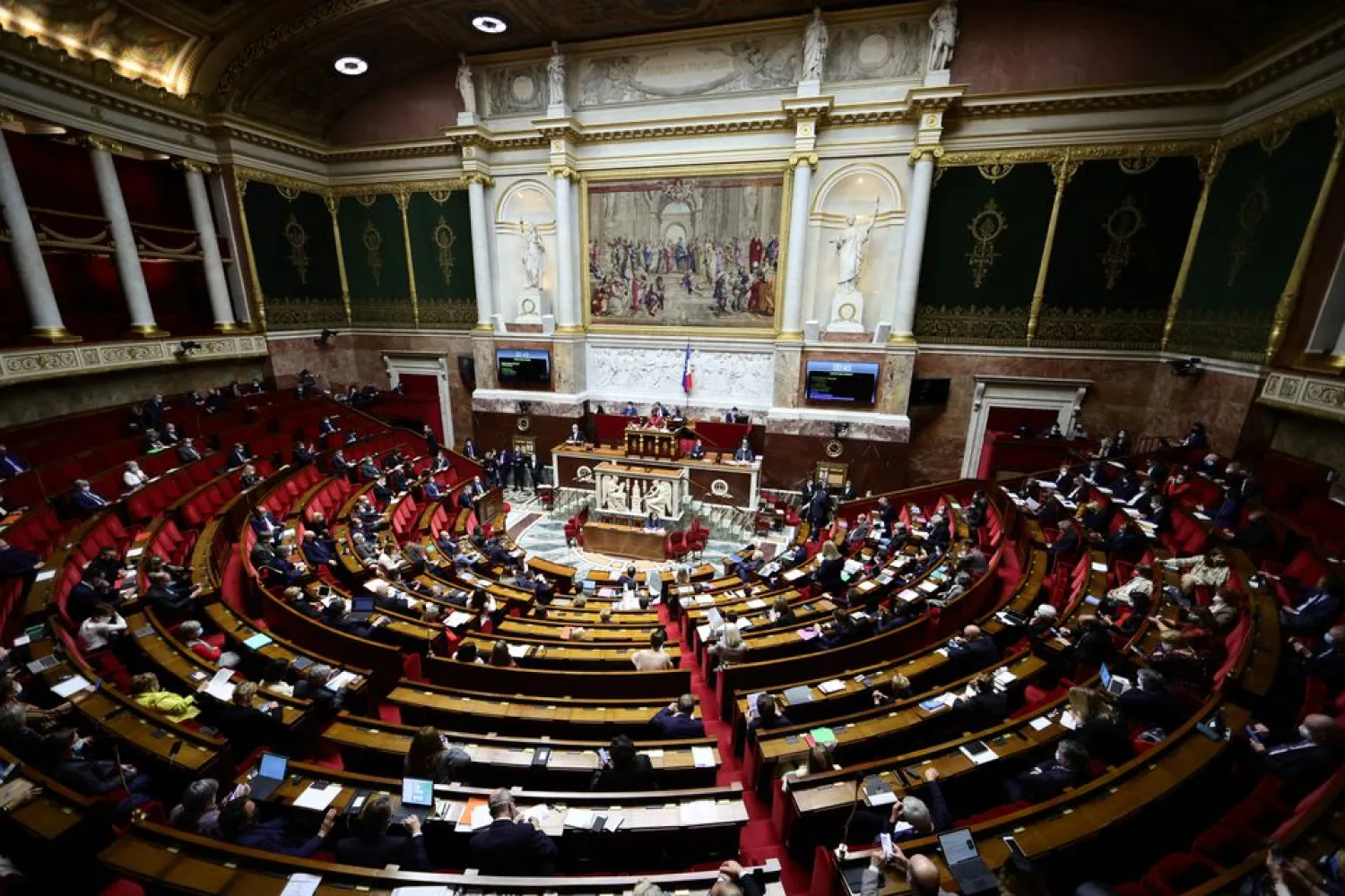 A general view shows the hemicycle during the opening debate on the French government's planned bill to transform the current health pass into a vaccine pass, at the National Assembly in Paris, France, January 3, 2022. REUTERS/Sarah Meyssonnier