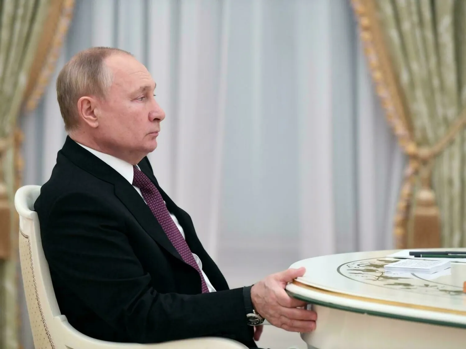 Russian President Vladimir Putin looks on during a meeting with Iranian President in Moscow on January 19, 2022. Pavel BEDNYAKOV SPUTNIK/AFP
