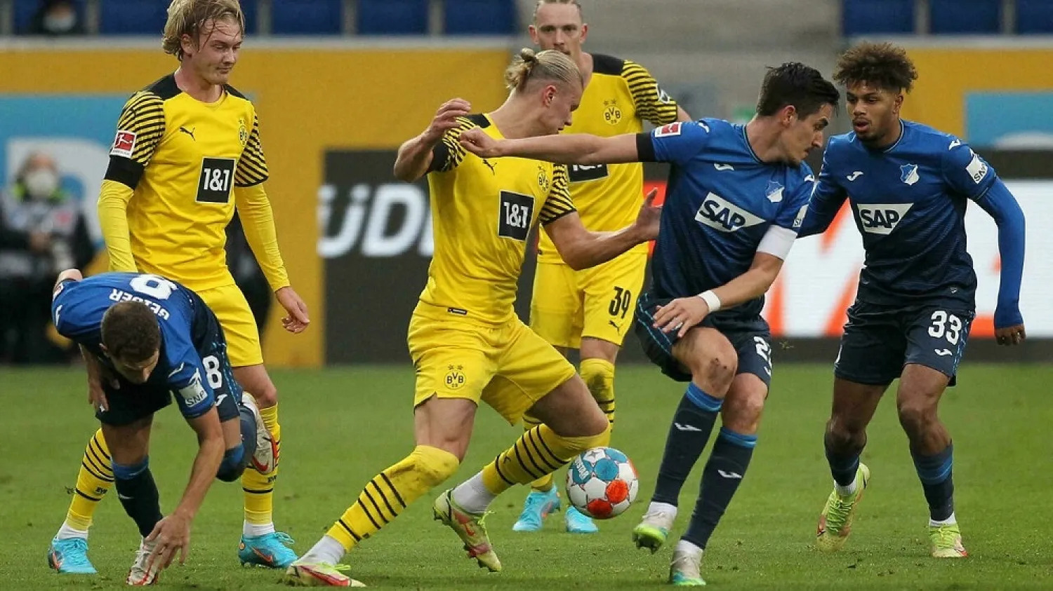 Borussia Dortmund battled to a 3-2 victory at Hoffenheim to close in on leaders Bayern Munich
