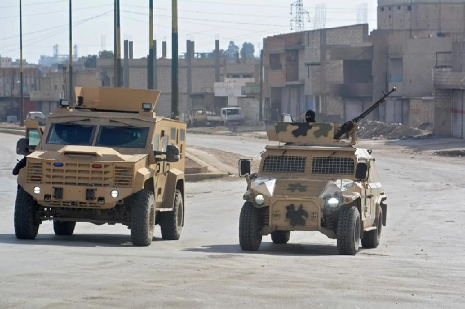 Syrian Democratic Forces (SDF) patrol a street in the northern Syrian city of Hasakah on January 23, 2022 - AFP