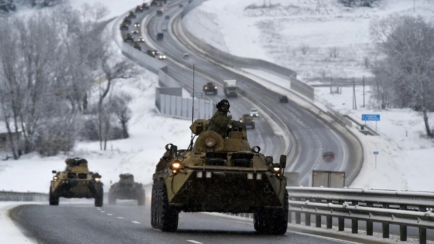 A convoy of Russian armored vehicles moves along a highway in Crimea, Tuesday, Jan. 18, 2022. (AP)