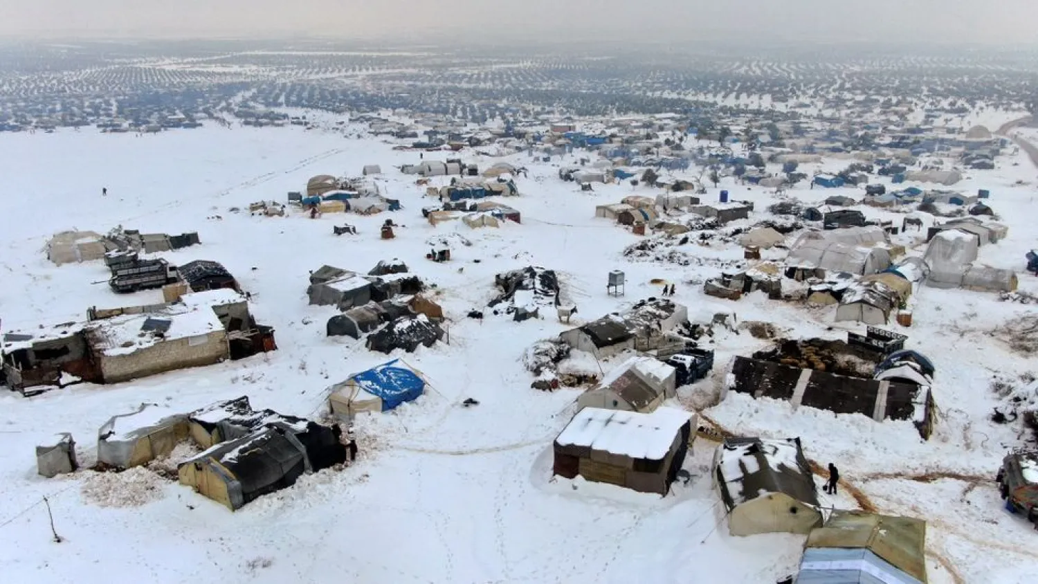 A snow covered camp for internally displaced people is seen in the Aleppo countryside, Syria January 23, 2022. Picture taken January 23, 2022. Picture taken with drone. (Reuters)